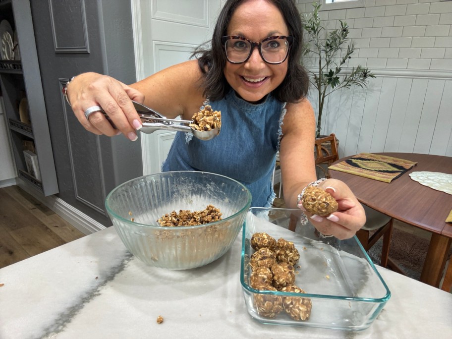 woman rolling protein bite