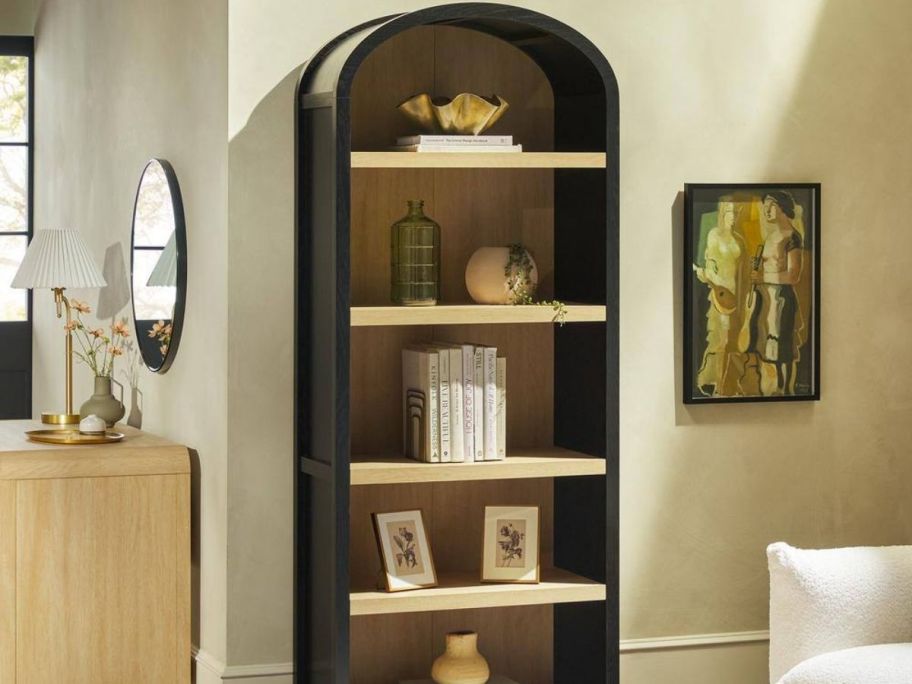 arched 5-Shelf Bookcase with items inside of each shelf