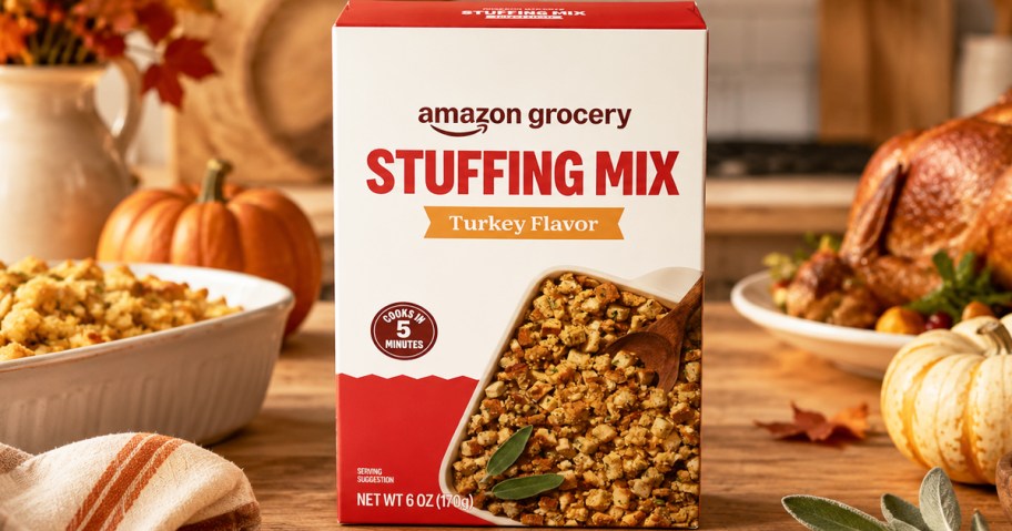 box of stuffing on a kitchen counter with thanksgiving foods and pumpkins in background