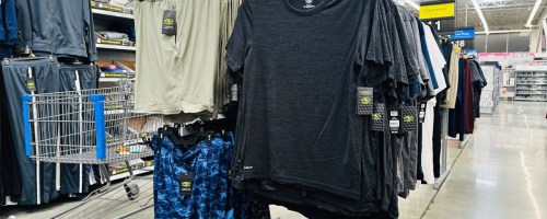 athletic top and shorts on display rack in store