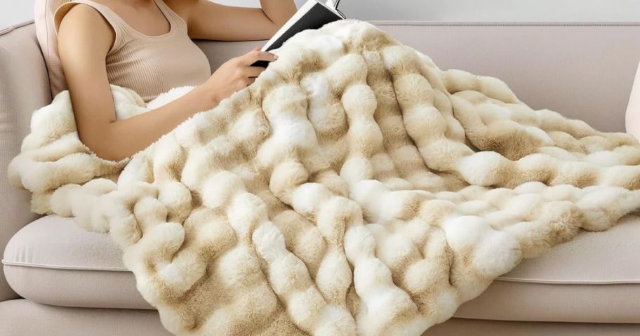 woman laying on couch with BEDELITE Faux Rabbit Bubble Throw Blanket