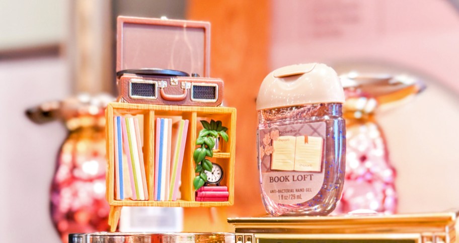 record player wallflowers plug holder and a small bottle of hand sanitizer