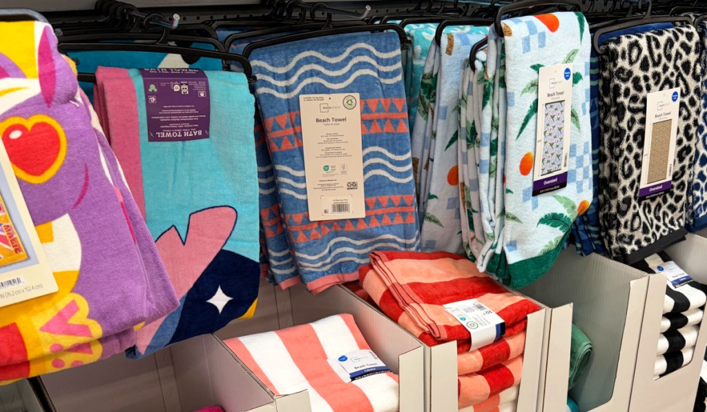 Beach towels on display inside of Walmart store