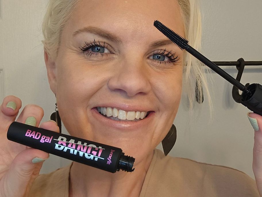 Woman applying Benefit BadGal Bang Mascara