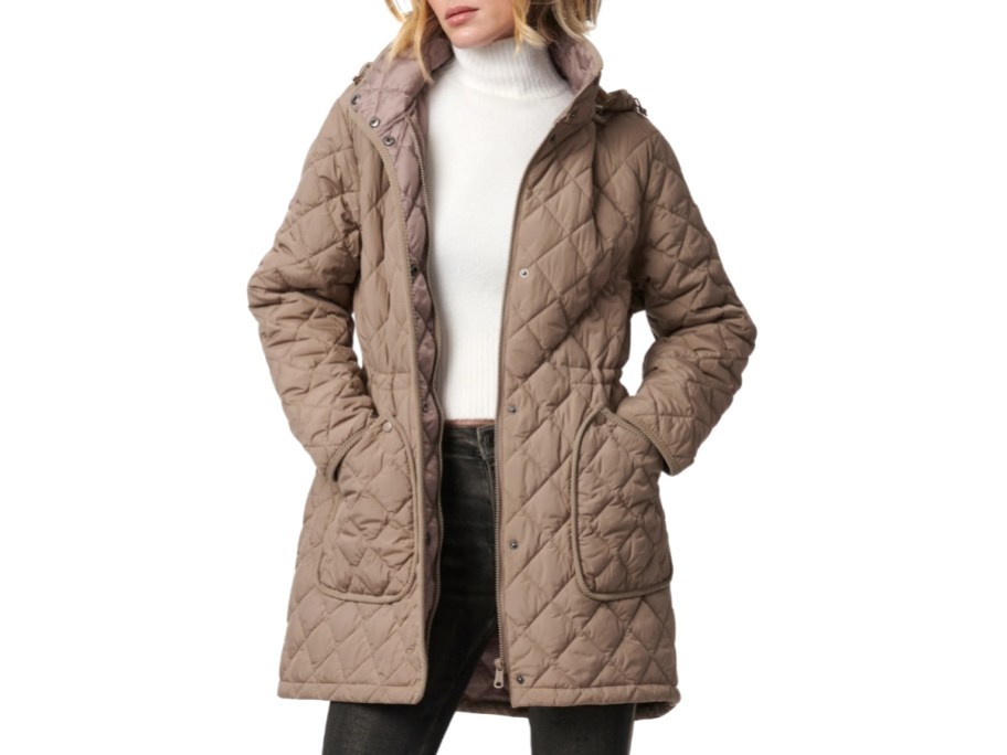 a woman in a quilted puffer coat