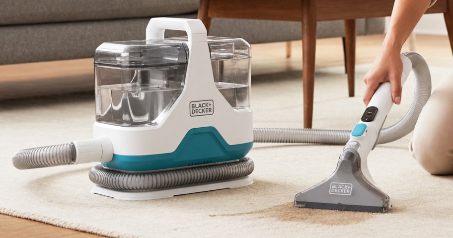 woman cleaning carpet with spot cleaner