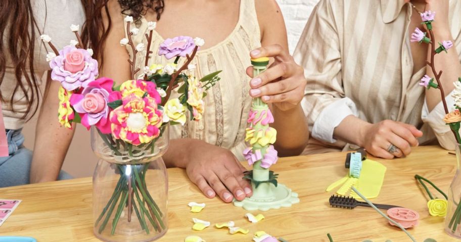 women building Blooms by Play-Doh kit