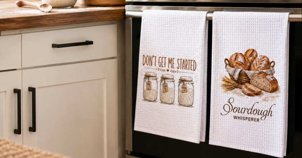 Sourdough themed kitchen towels hanging on oven handle