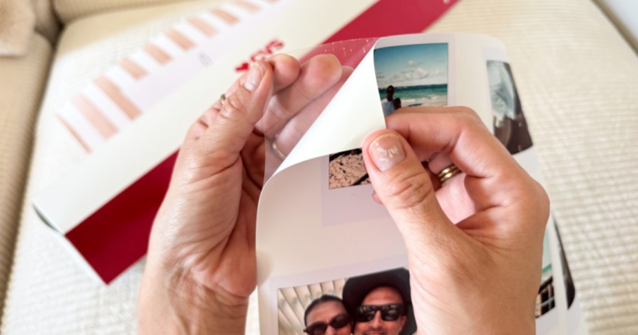 Hand peeling apart, sticky backing from CVS poster