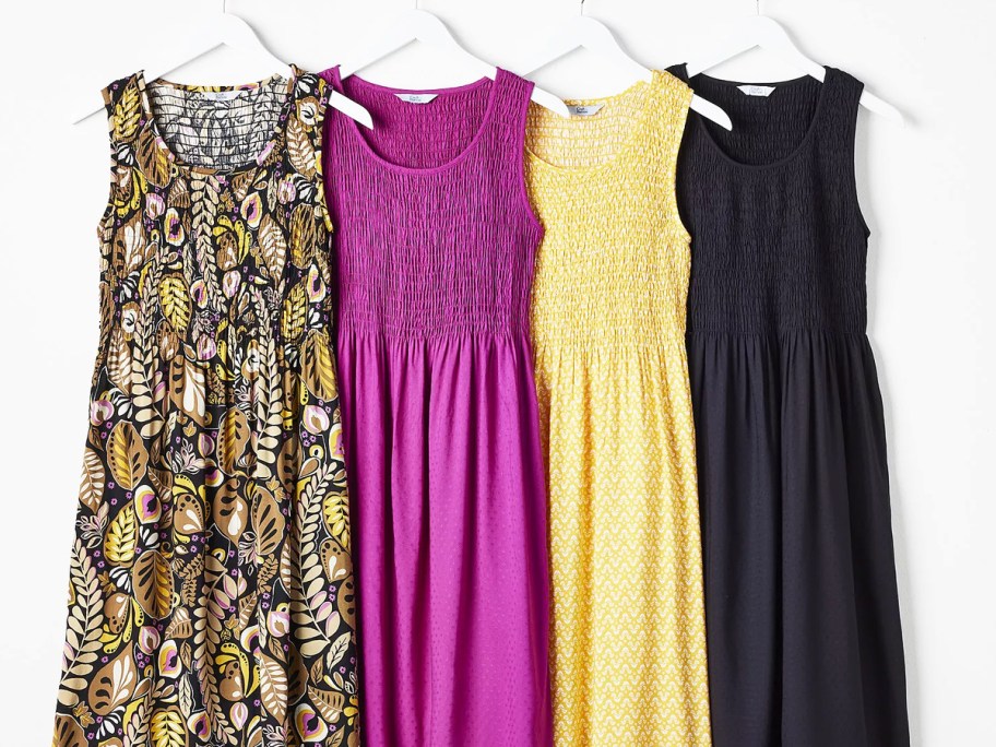 colorful smocked dresses on hangers