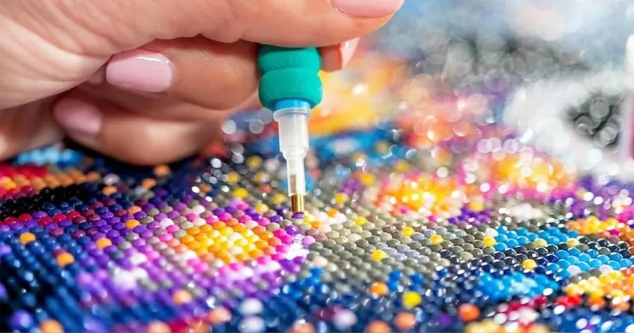 pressing diamonds onto a diamond painting