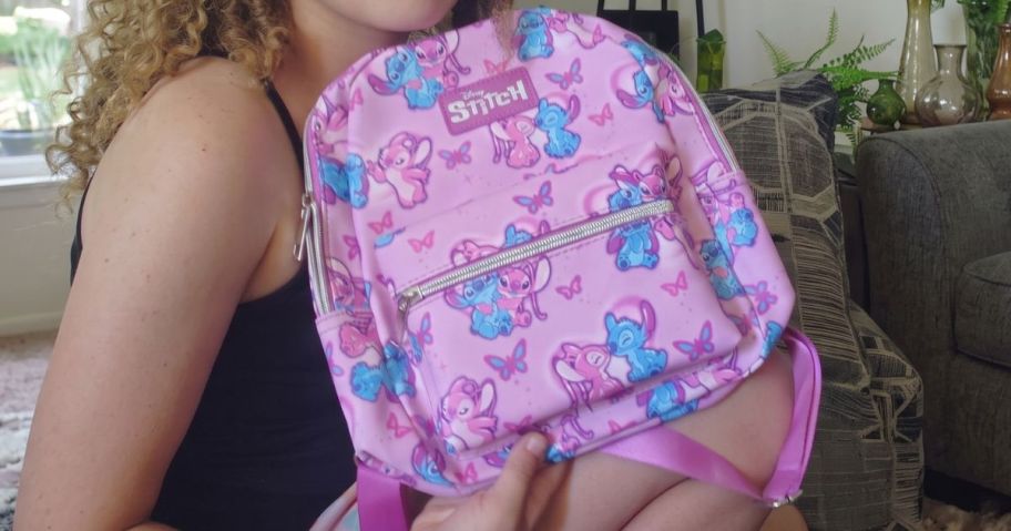 woman holding Disney's Lilo & Stitch Angel & Stitch Mini Backpack