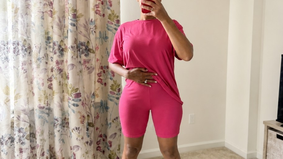 a woman taking a selfie wearing a pink 2 piece lounge set