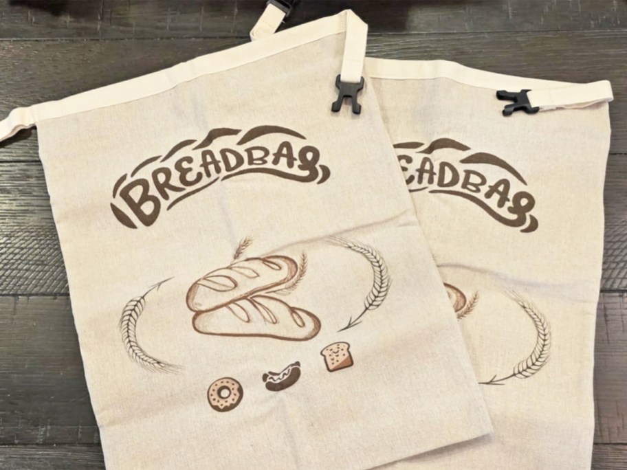 two beige bread bags on a counter