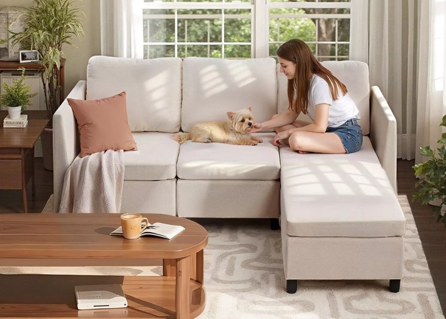 girl and dog on a 3 seater sectional 