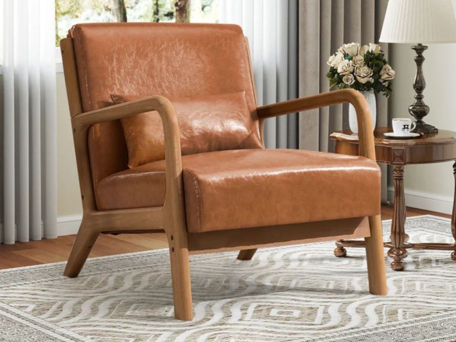 George Oliver Mid Century Faux Leather Accent Chair w/ Extra Pillow in living room