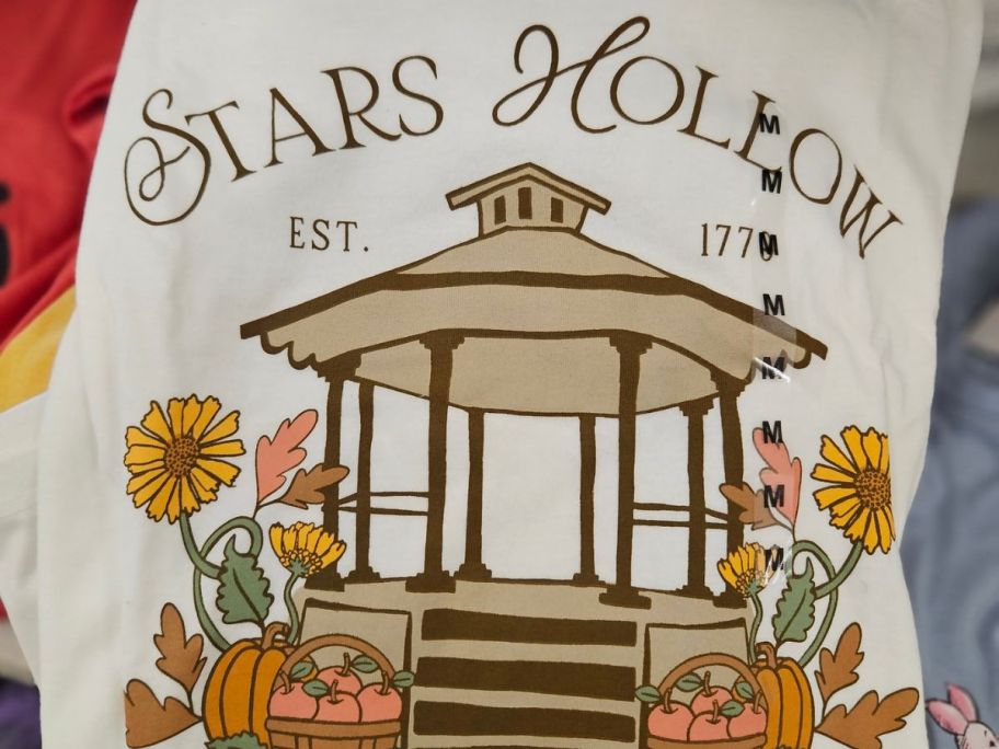 hand holding Gilmore girls Halloween graphic tee shirt