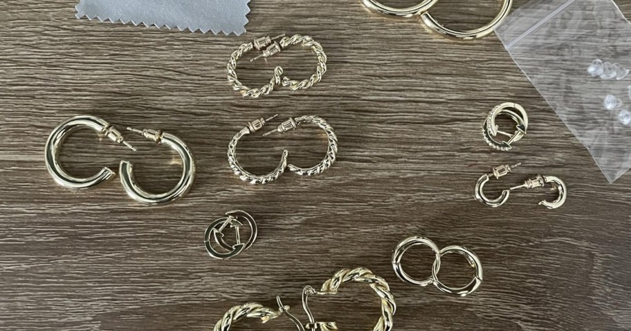 Gold Hoop Earrings laying on a table