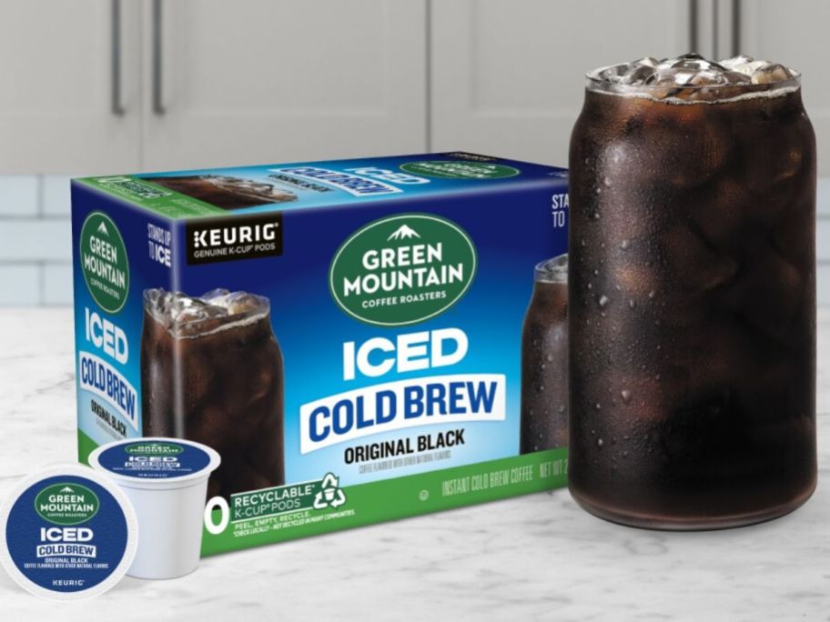 A box of Green Mountain Iced K-Cups with 2 k-cups and a cup of black iced coffee
