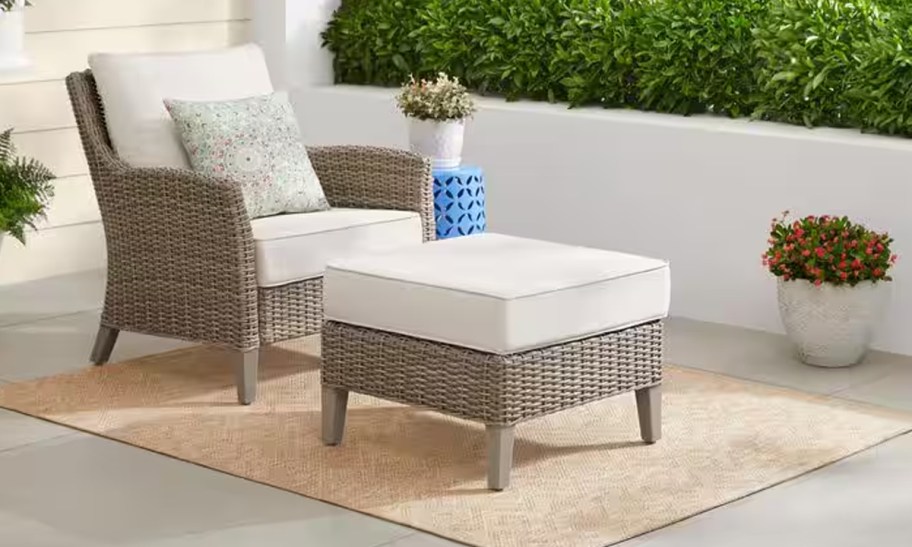 Hampton Bay Holly Cove 2-Piece Wicker Outdoor Seating Set with CushionGuard Almond Cushions sitting on a patio