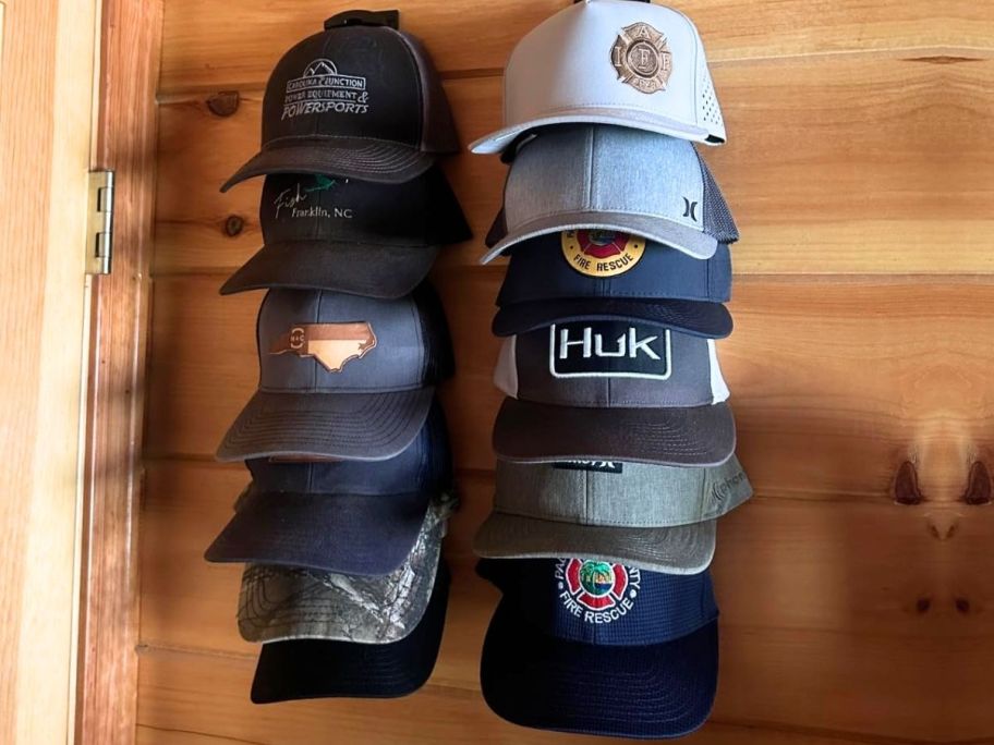 Hats hanging on Houoisheck Hat Organizer 2-Pack