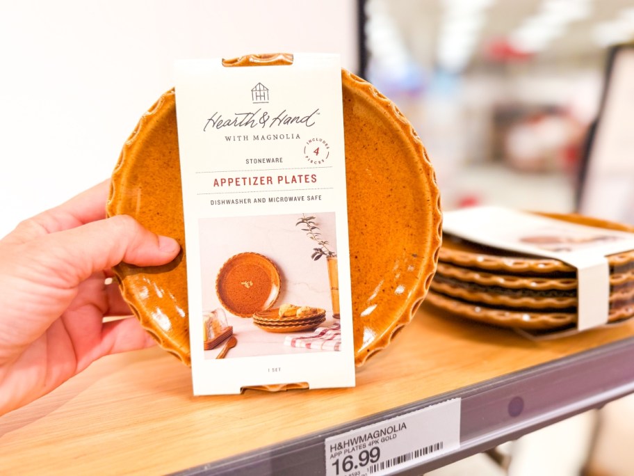 holding orange appetizer plates