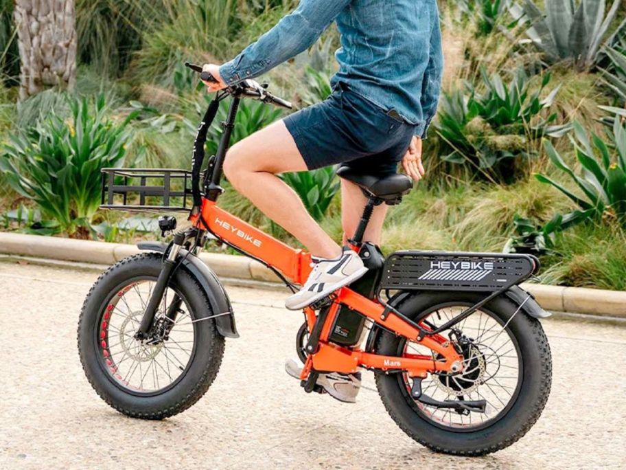 man sitting on Heybike Mars 2.0 eBike on sidewalk