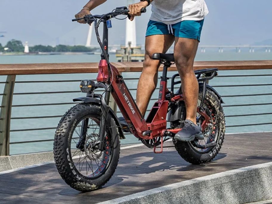 person riding Heybike Ranger 3.0 Pro eBike next to lake