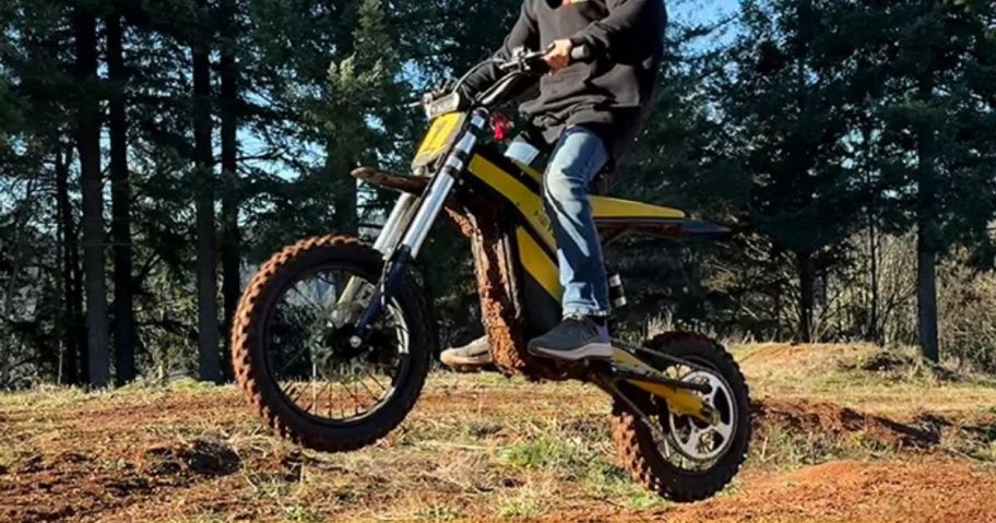 person riding Heybike Villain eBike in field