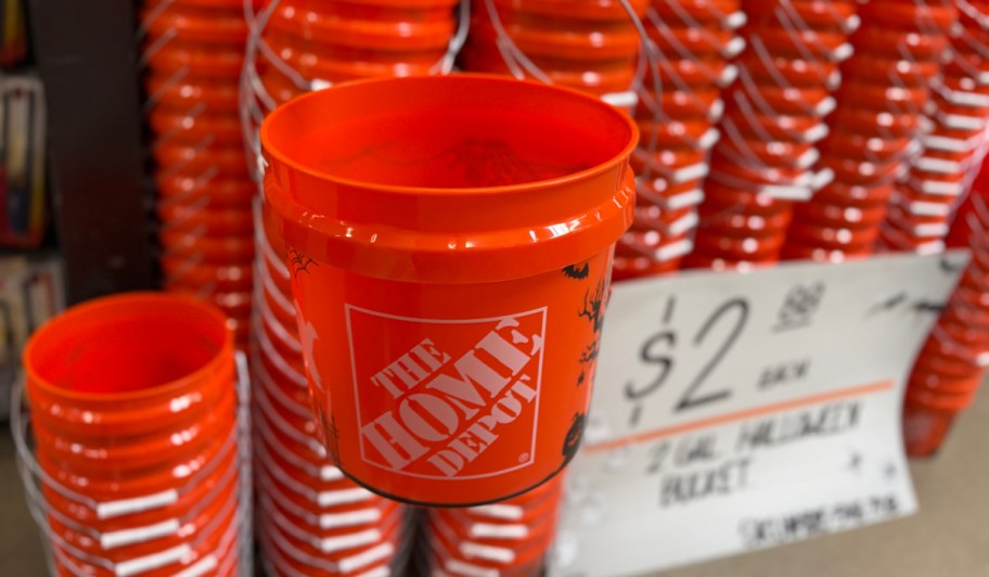 Home Depot Halloween Buckets near a sale sign