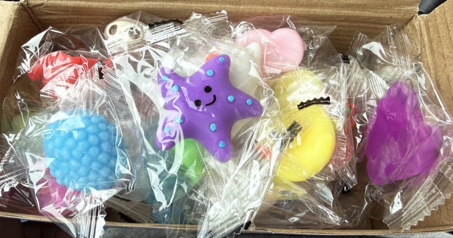 box of individually wrapped mini squish toys