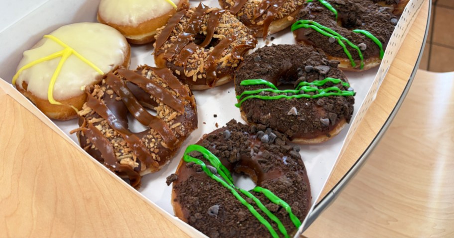 Krispy Kreme Girl Scout Cookie Doughnuts in a box on a table
