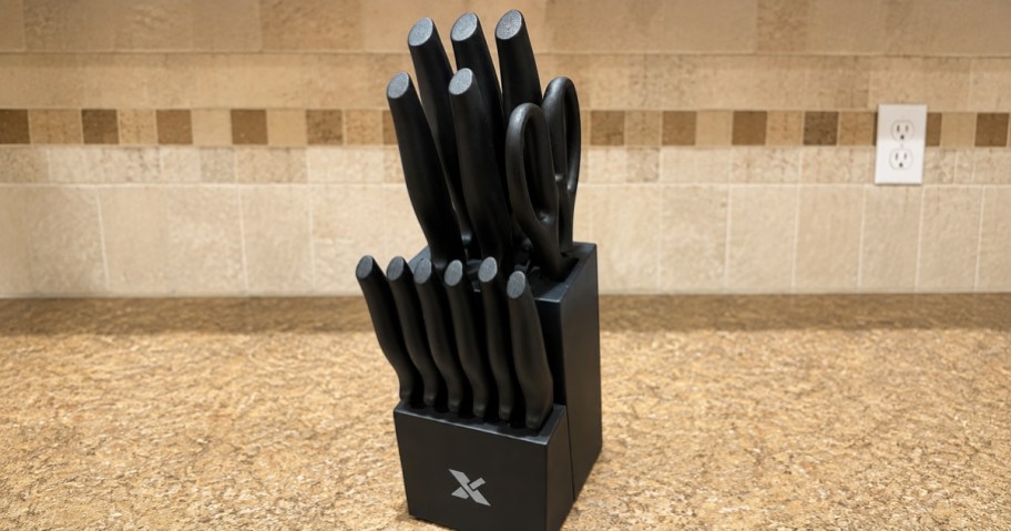 a knife set in black on a kitchen countertop