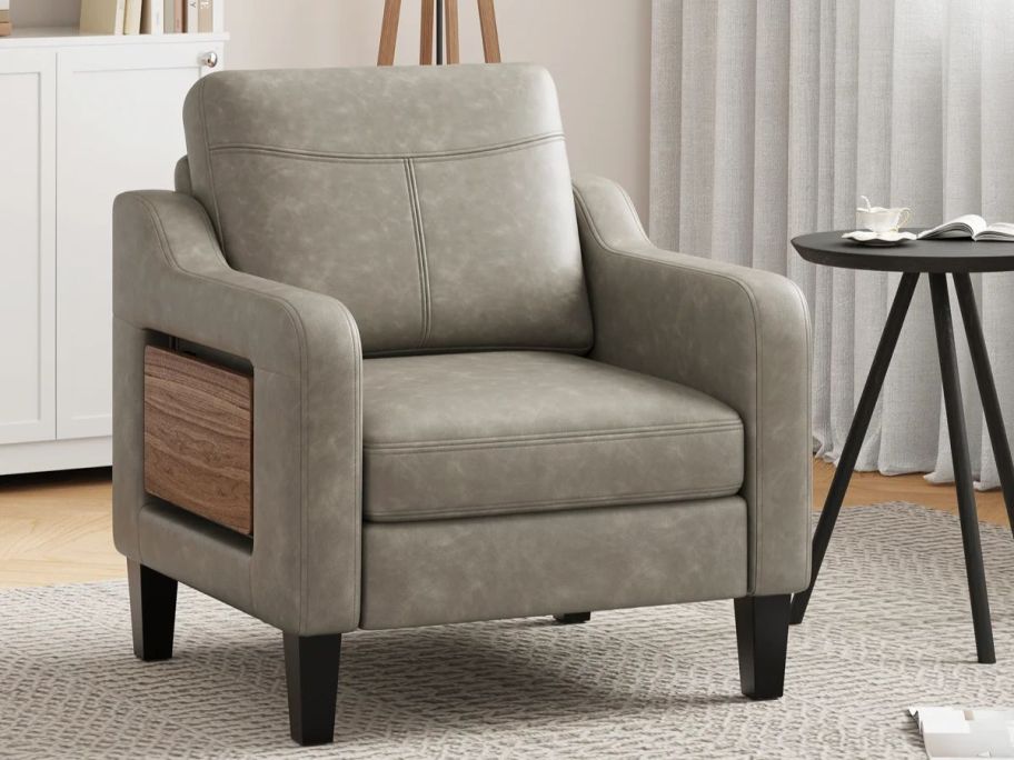 Latitude Run Lambertville Wide Upholstered Accent Chair Faux Leather Armchair in living room