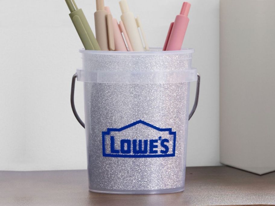 A Lowe's Silver Glitter Mini Bucket filled with pens