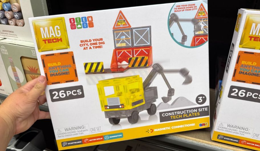 hand holding a box of MAG Tech building set