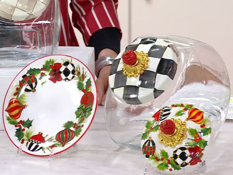 A MacKenzie-Childs Cookie Jar with extra holiday lid and matching salad plate