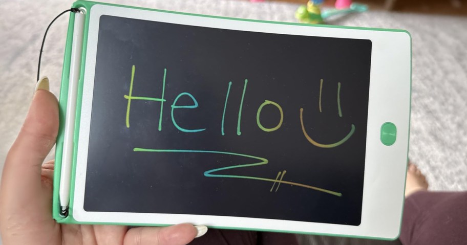 Magic Doodle Board being held with the word Hello