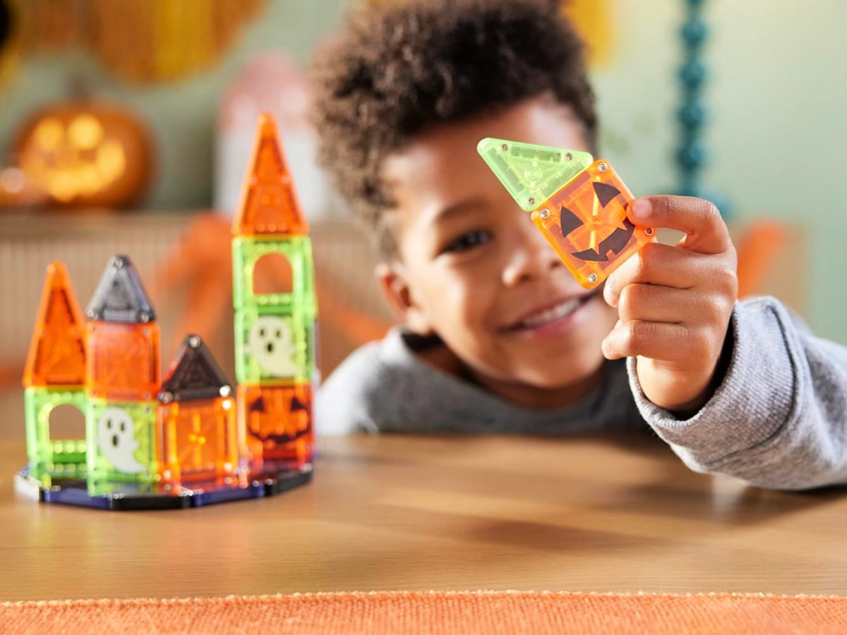 little boy playing with Magna Tiles Spooky Set