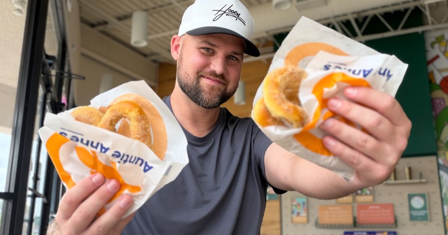 Man holding BOGO Pretzels at Auntie Anne's