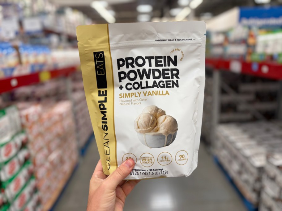 A pouch of Clean Simple Eats Protein Powder + Collagen in Simply Vanilla being held in a store.