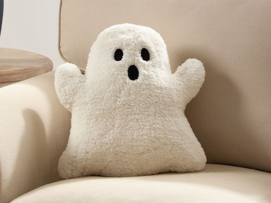 My Texas House 16" x 14" Ivory Ghost Shaped Decorative Pillow on couch