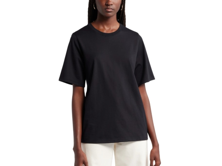 a woman in a crew neck tee