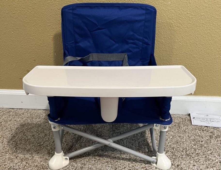 A Nuby Booster Seat with a removable tray