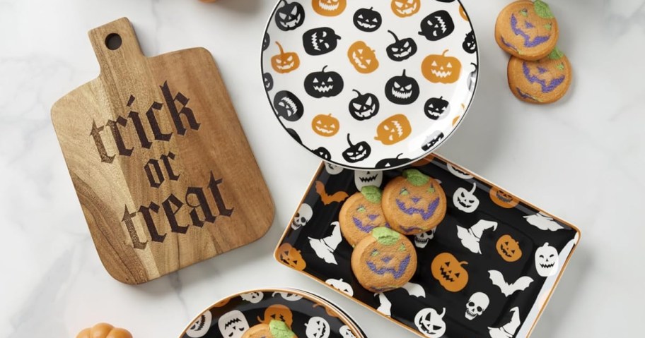 halloween plates, tray, and wood cheese board