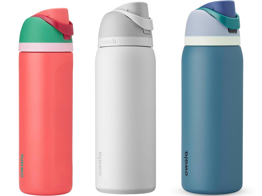 pink, white, and blue Owala FreeSip Stainless Steel Water Bottles in a row