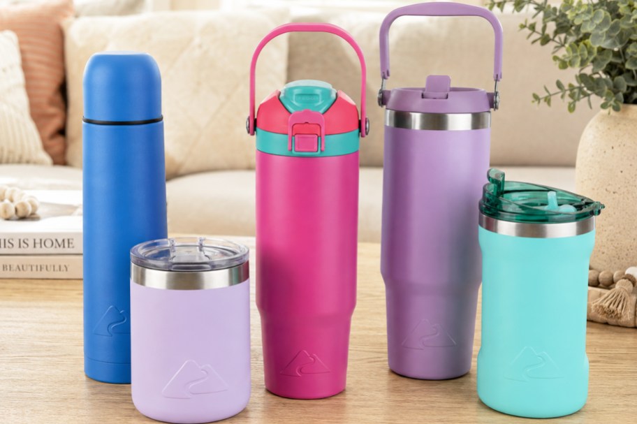 colorful water bottles and tumblers on a table