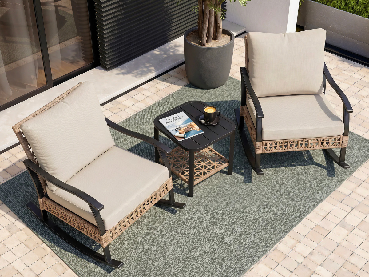 Rattan rocking chairs with matching dining table outside on patio
