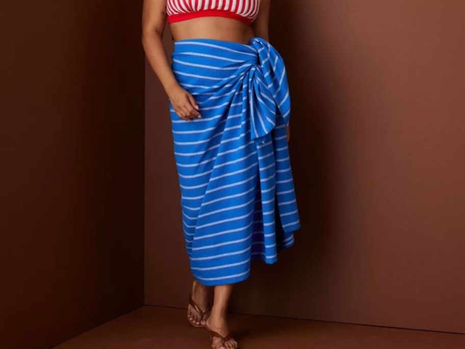 woman wearing Rosie Assoulin x Target Striped Turkish Sarong