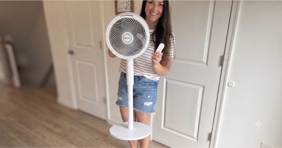 Alli holding white Shark FlexBreeze and remote